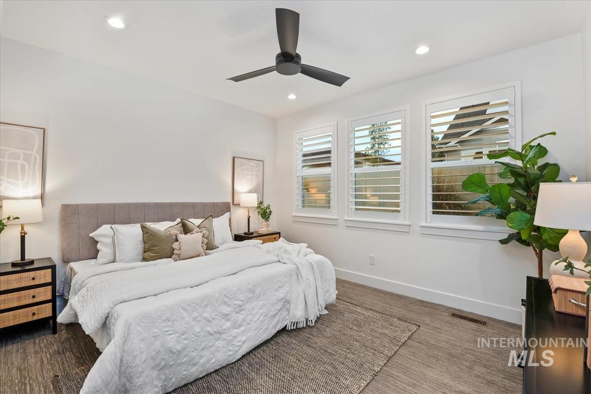 Bedroom with recessed lighting and ceiling fan