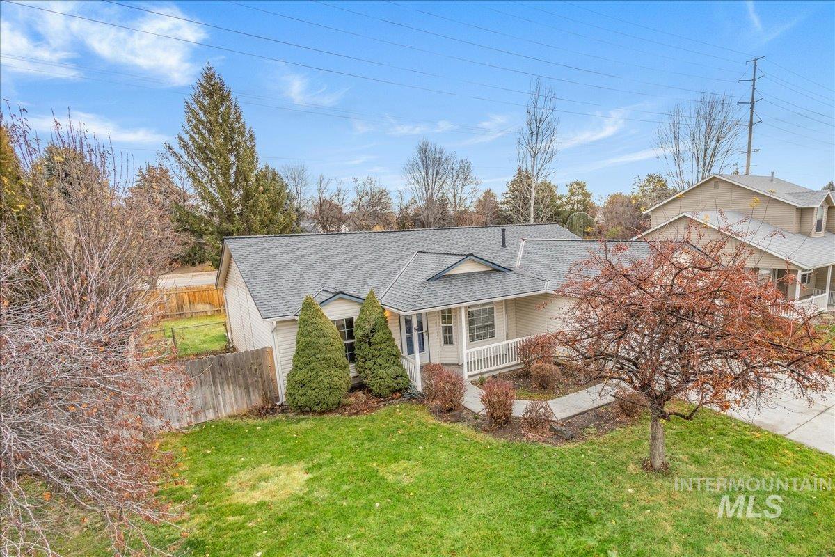 View of front of property featuring roof with shingles and covered porch