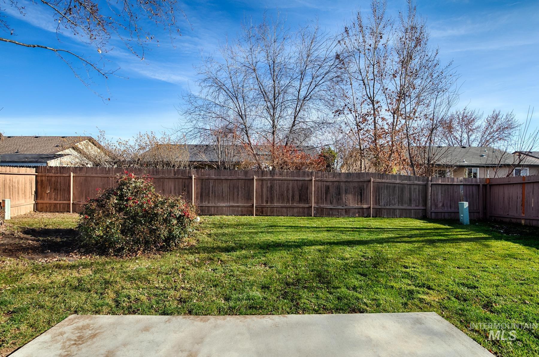 View of fenced backyard