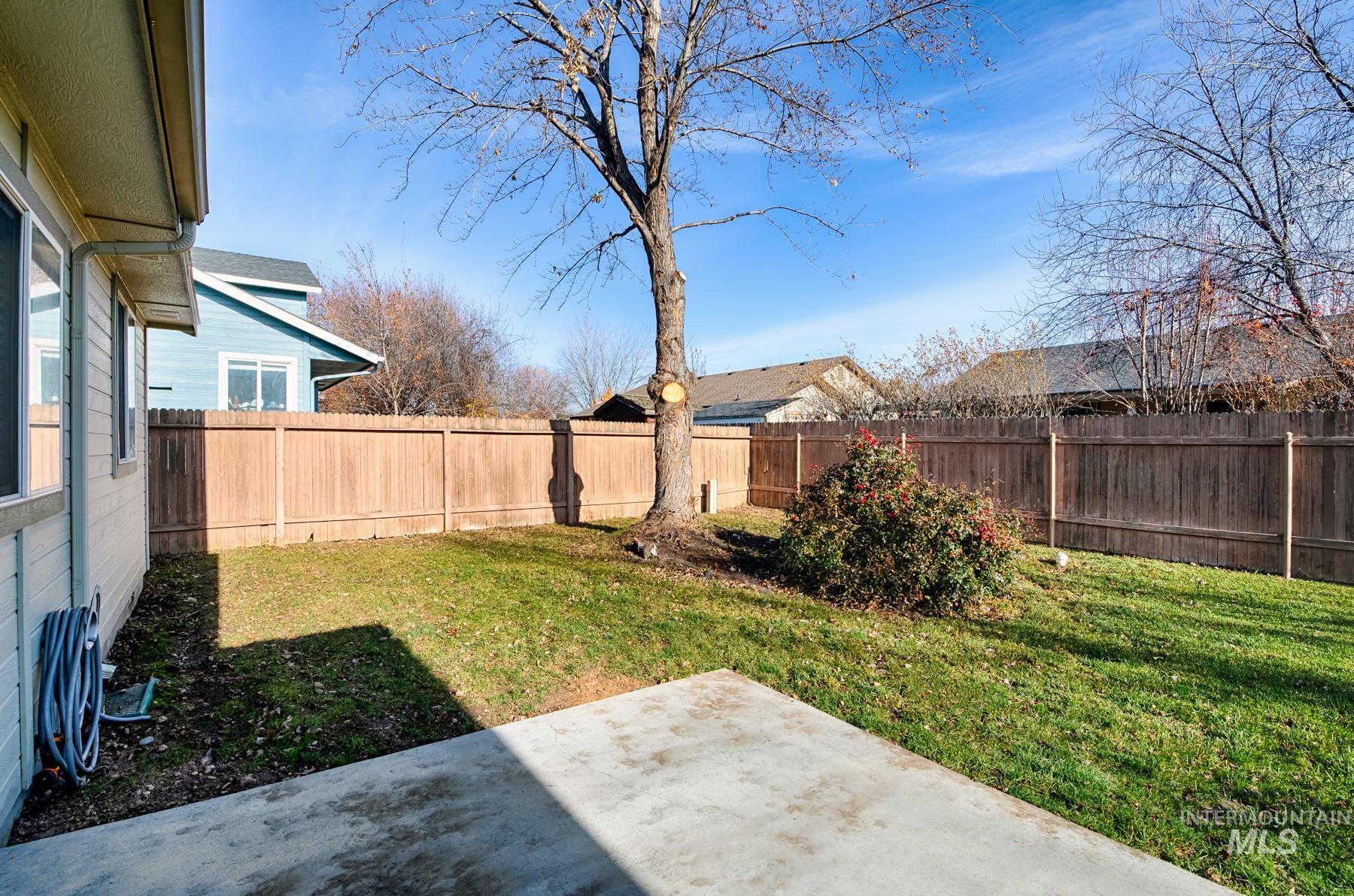 Fenced backyard featuring a patio area
