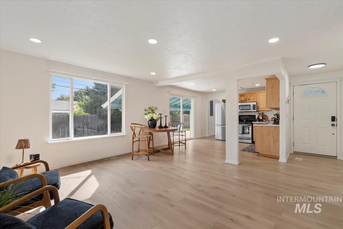 Living area featuring recessed lighting, light wood-type flooring, and healthy amount of natural light