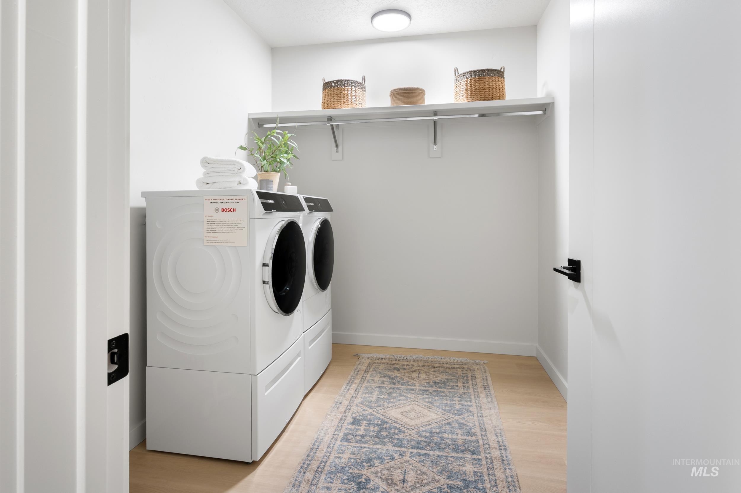 Washroom featuring independent washer and dryer