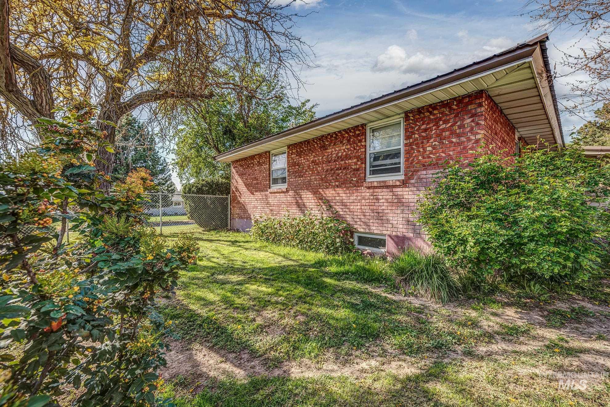 View of side of property featuring brick siding