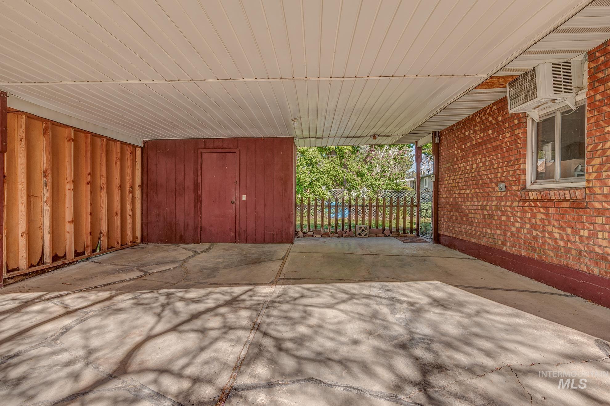 View of patio with an attached carport