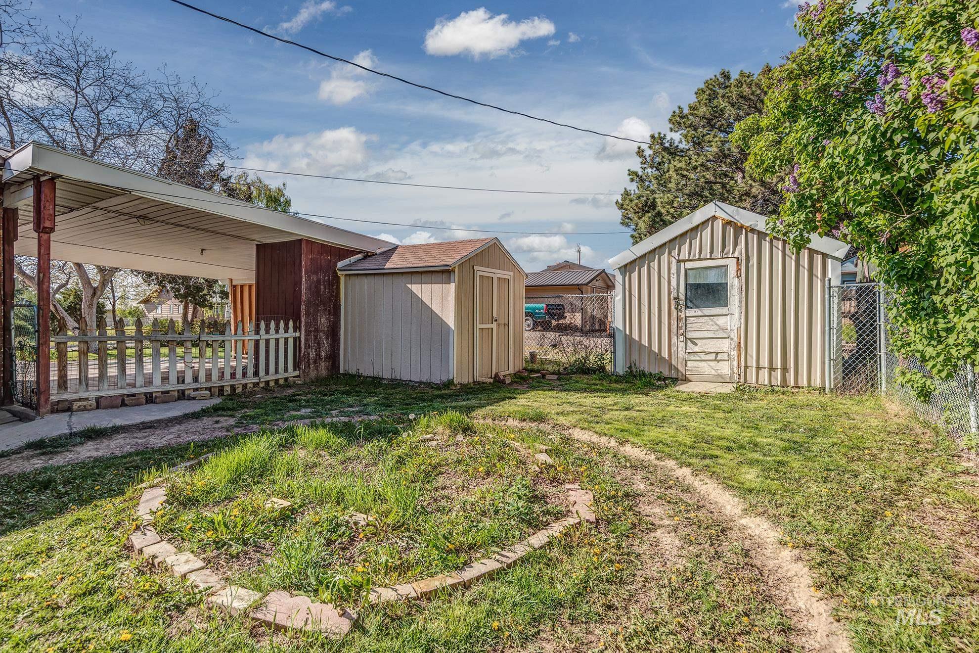 Fenced yard with a storage shed