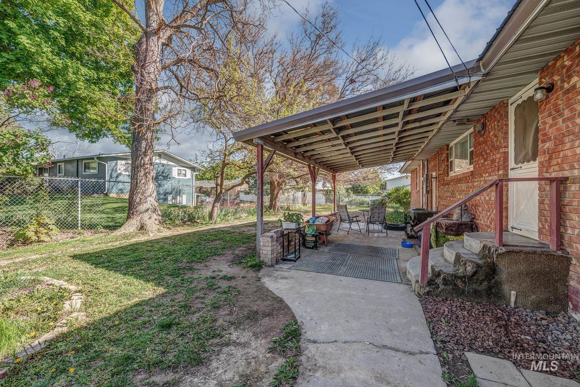 Fenced yard featuring a patio