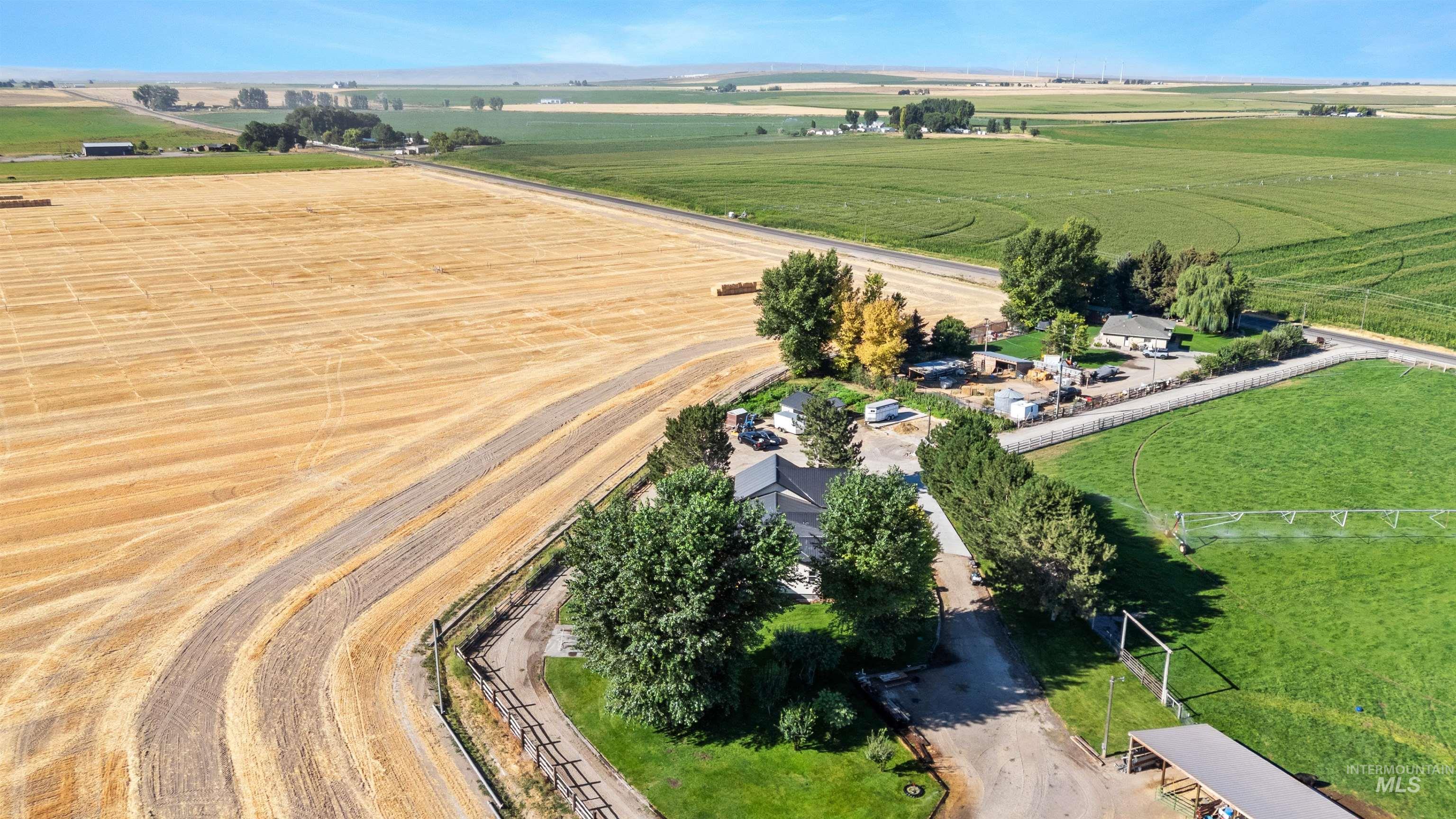 Aerial view of property's location with rural landscape and abundant farmland