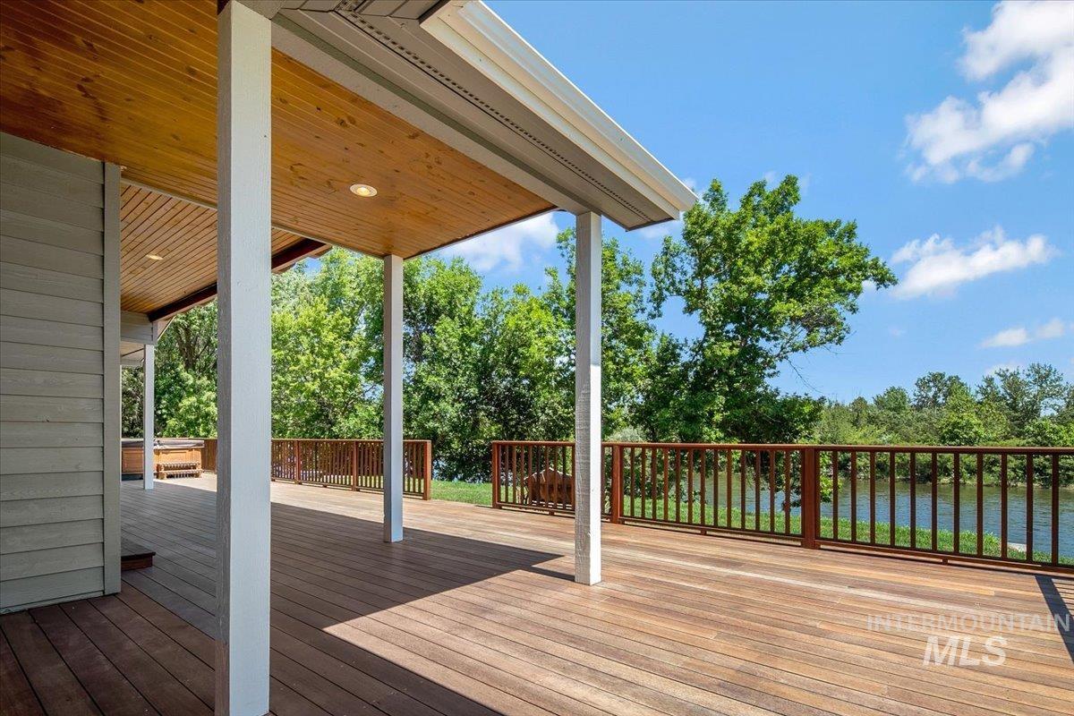 Wooden deck featuring a water view