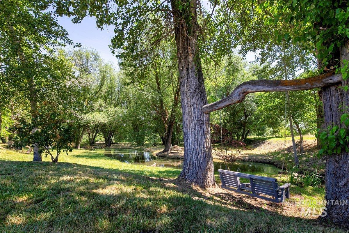 View of grassy yard with a water view