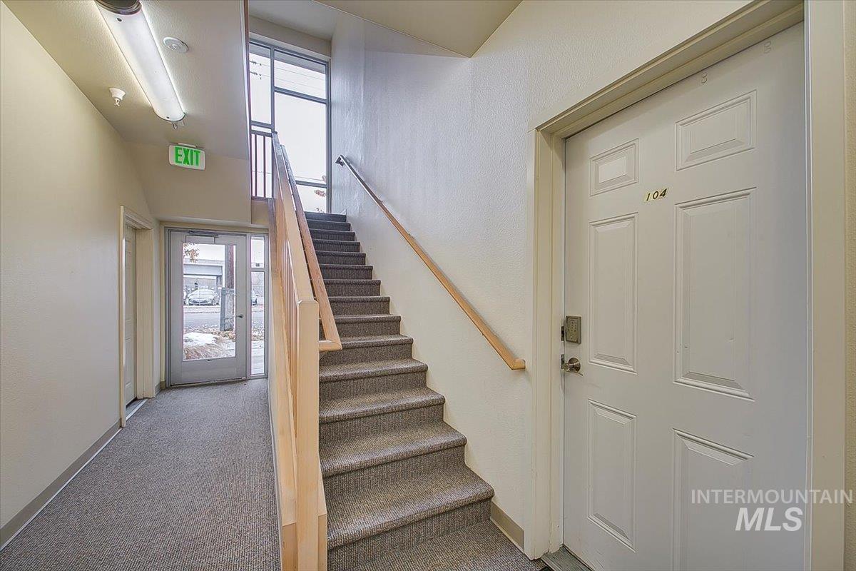 Stairway featuring carpet floors and baseboards