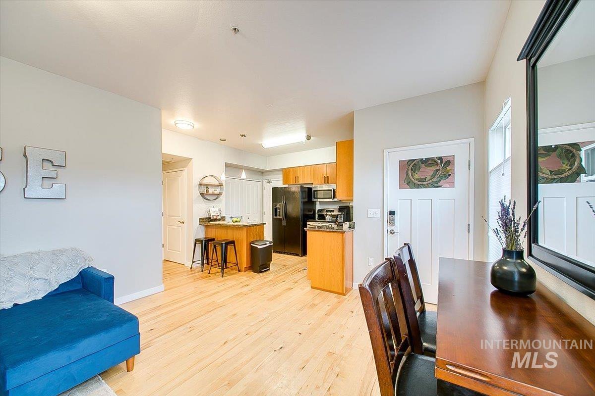 Living room with light wood finished floors and baseboards