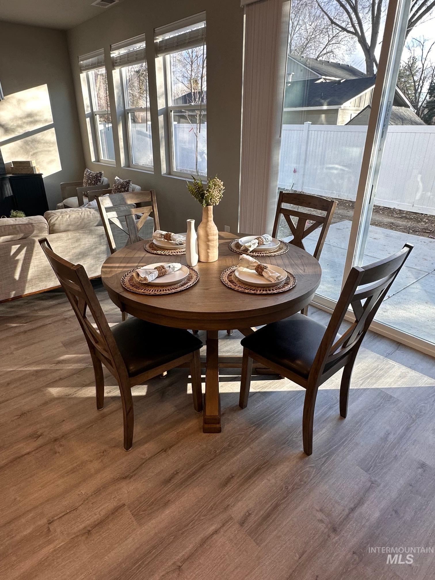 Dining area featuring wood finished floors