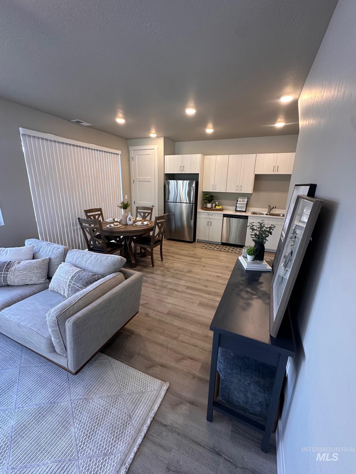 Living area featuring light wood-style floors
