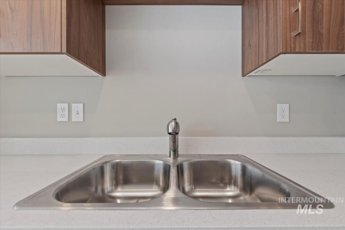 Kitchen view of brown cabinets and modern cabinets