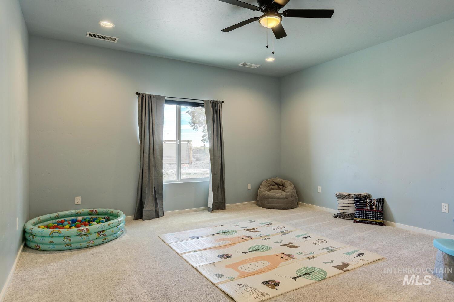 Game room featuring carpet flooring, recessed lighting, and a ceiling fan