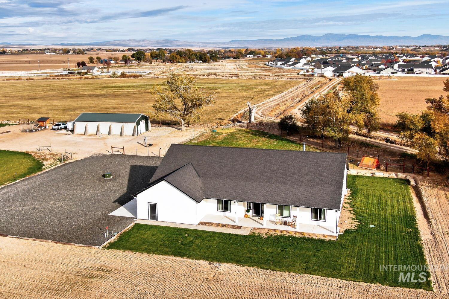 Aerial view of sparsely populated area featuring a mountainous background