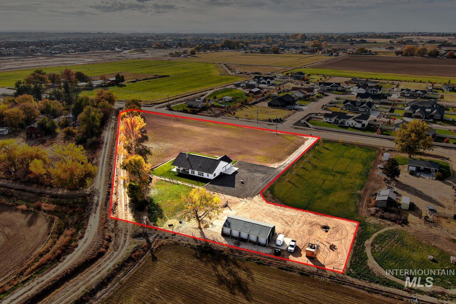 Aerial view of sparsely populated area with property boundaries highlighted