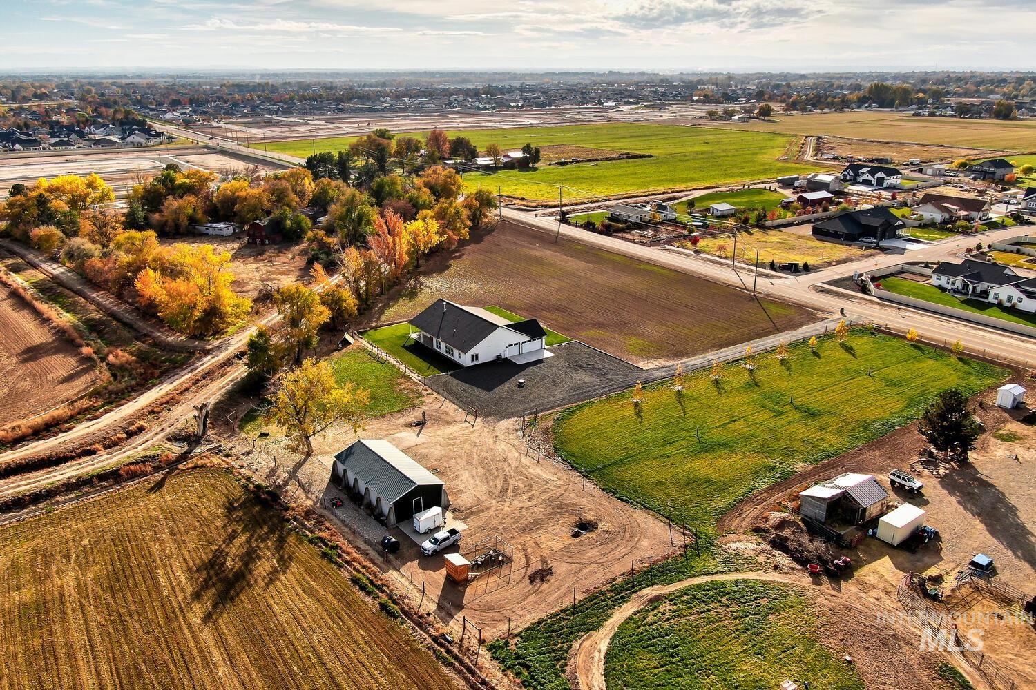 Aerial overview of property's location with rural landscape and abundant farmland