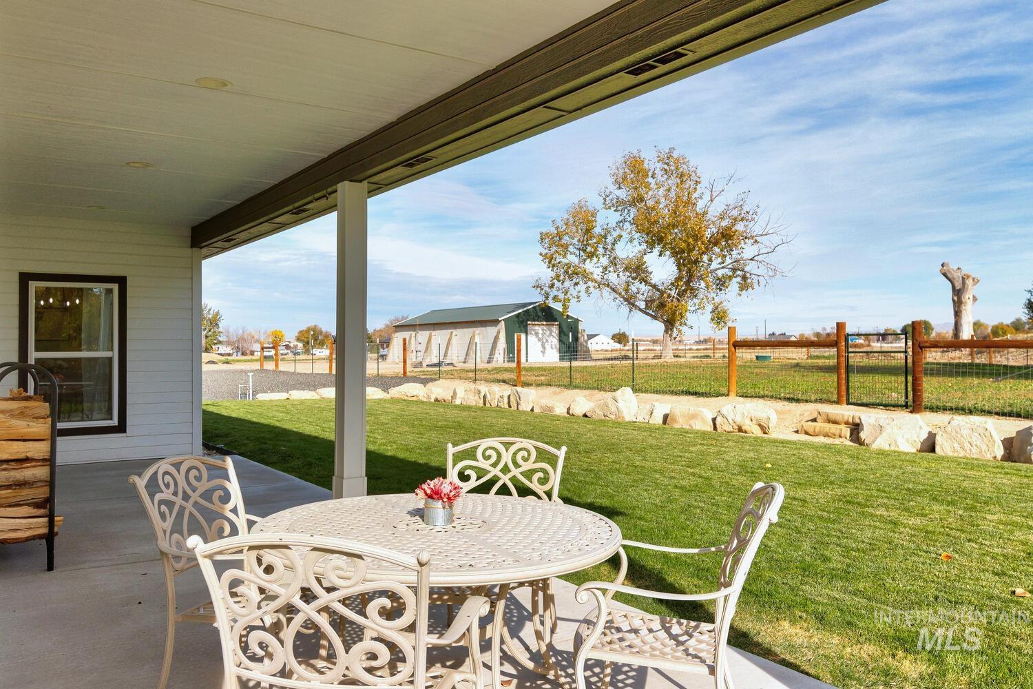 View of patio / terrace featuring outdoor dining space and an outdoor structure