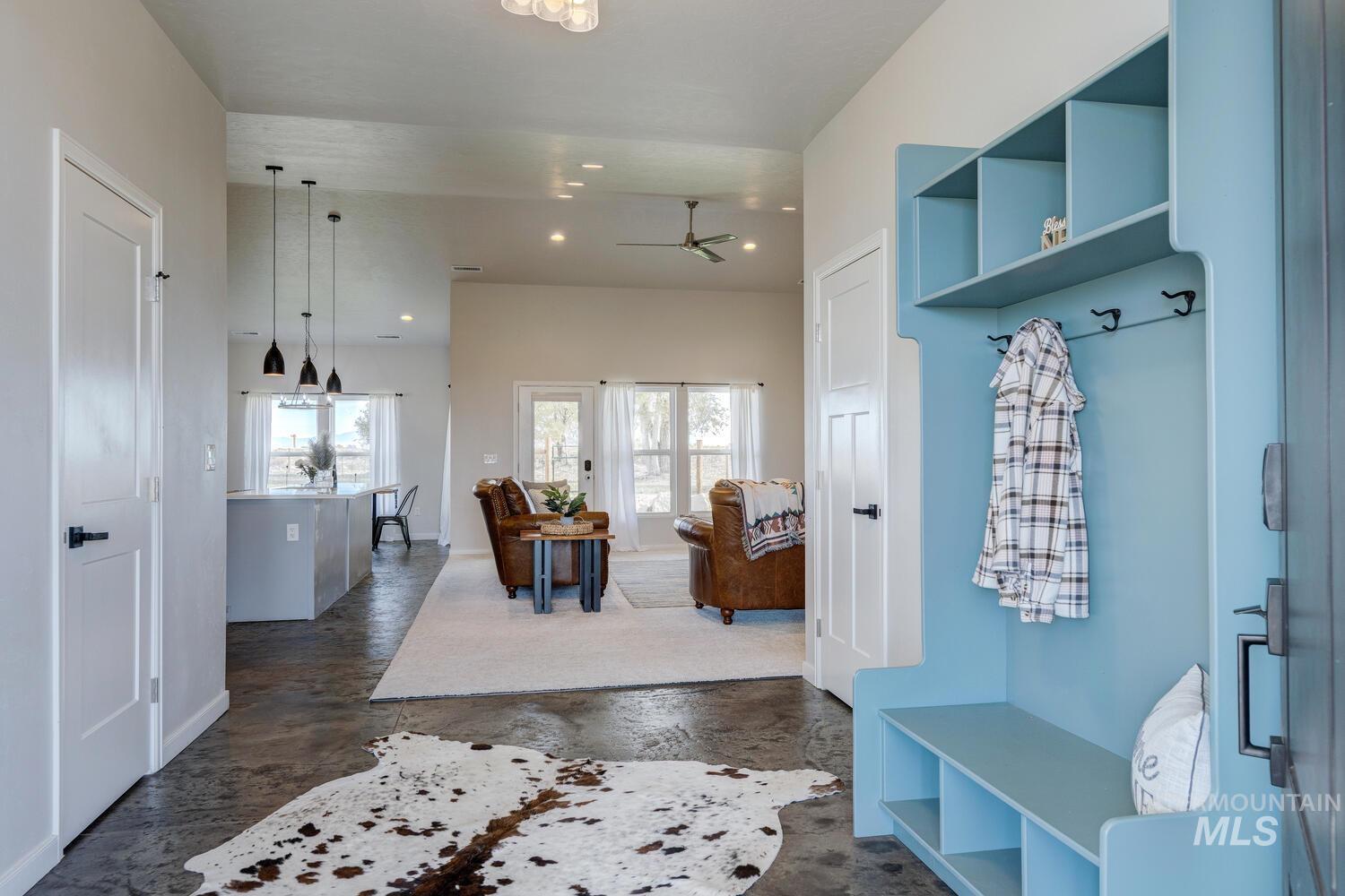Mudroom featuring concrete flooring, recessed lighting, and a ceiling fan