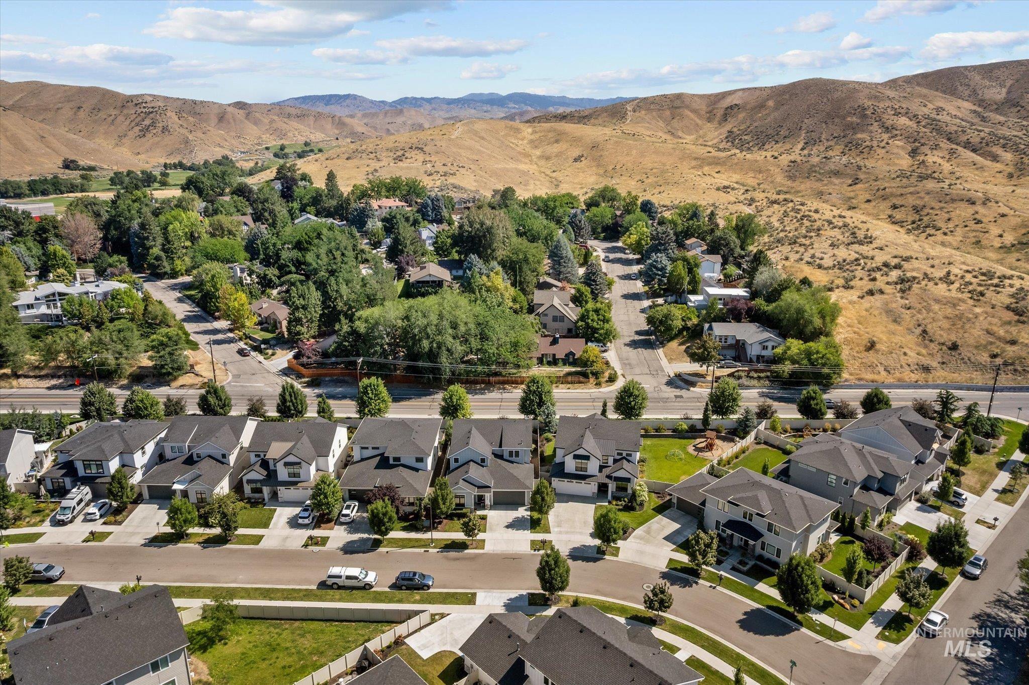 View of property location featuring nearby suburban area and a mountainous background