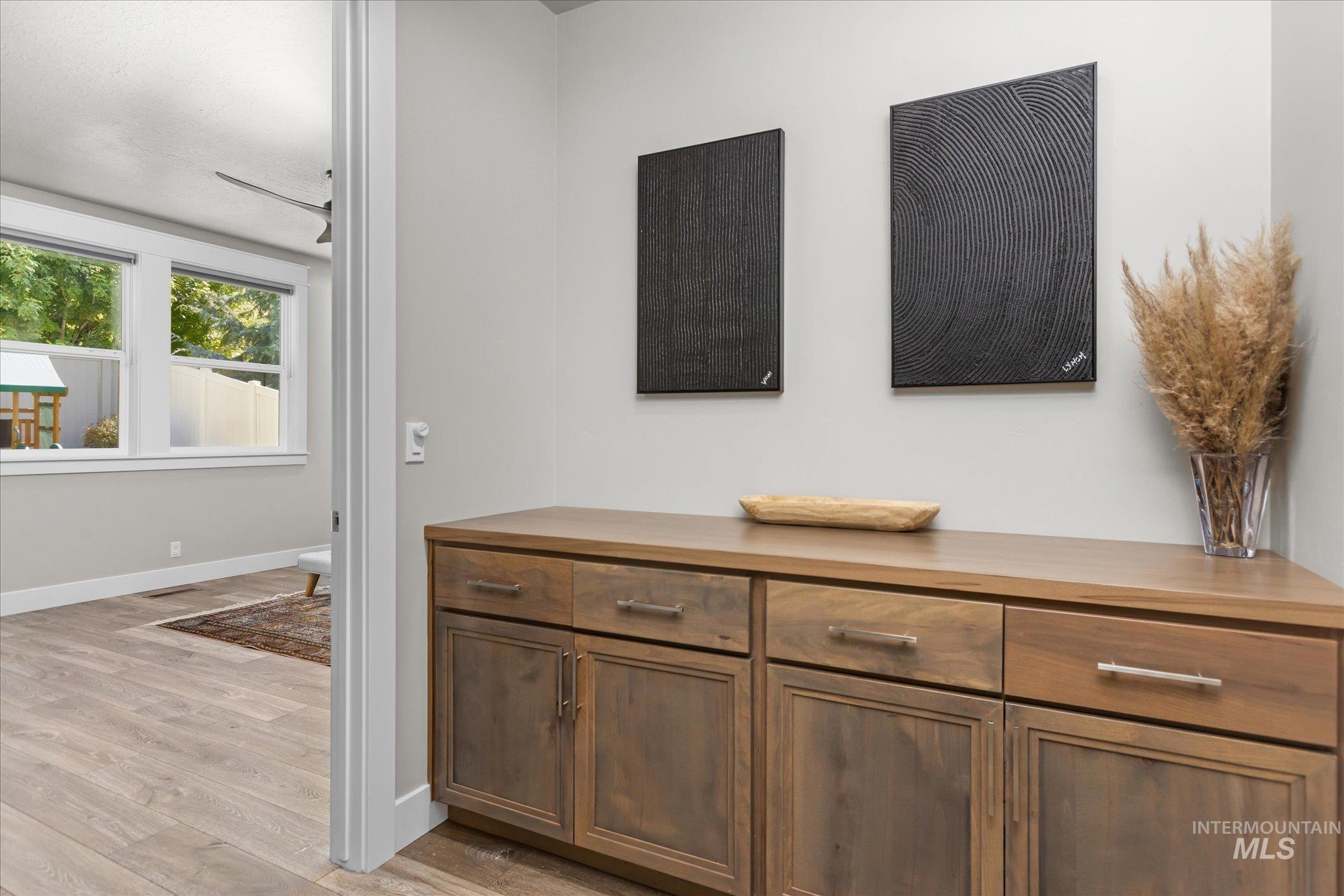 Detailed view of wood finished floors and baseboards