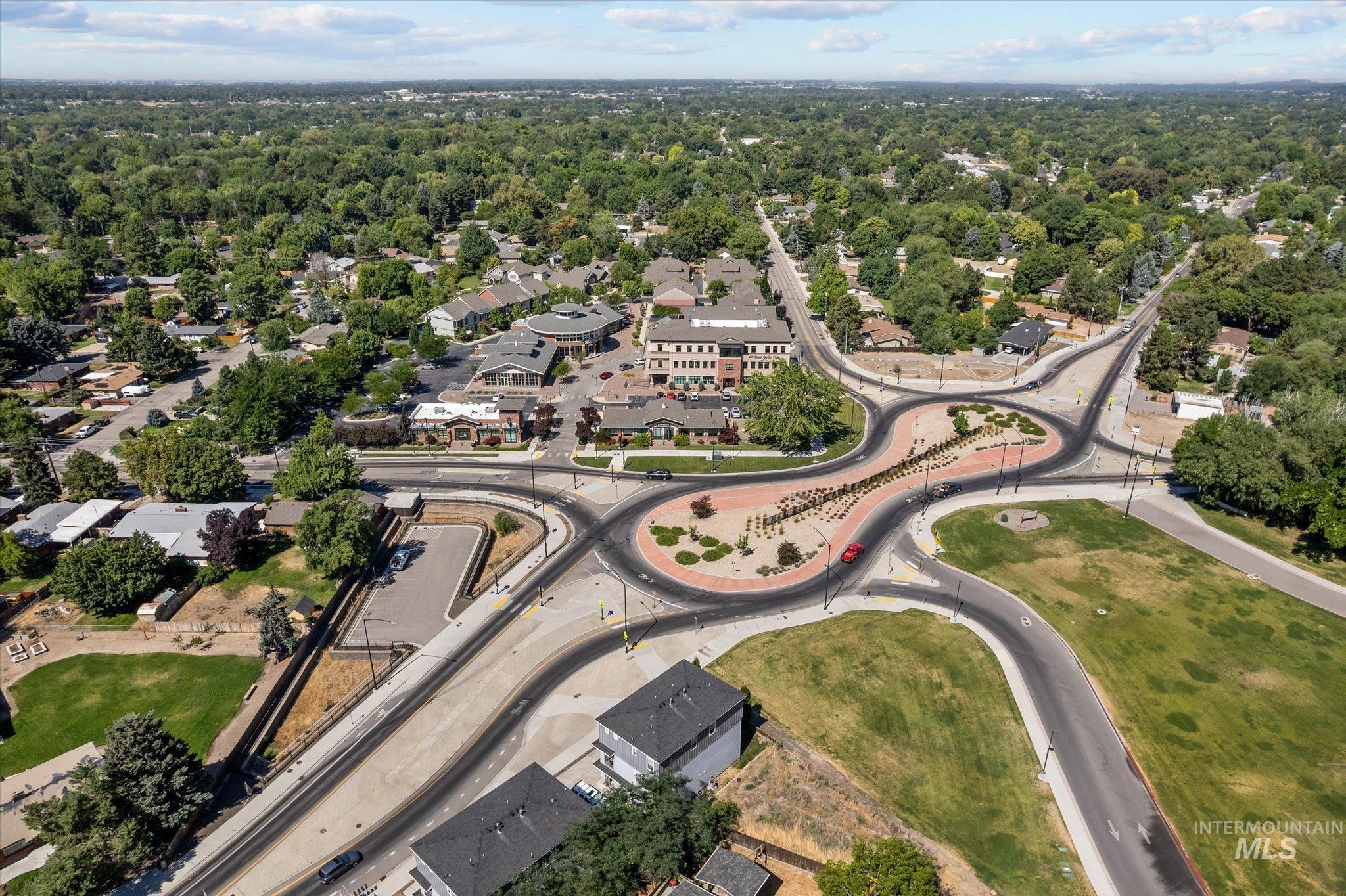 Aerial view of property's location with nearby suburban area