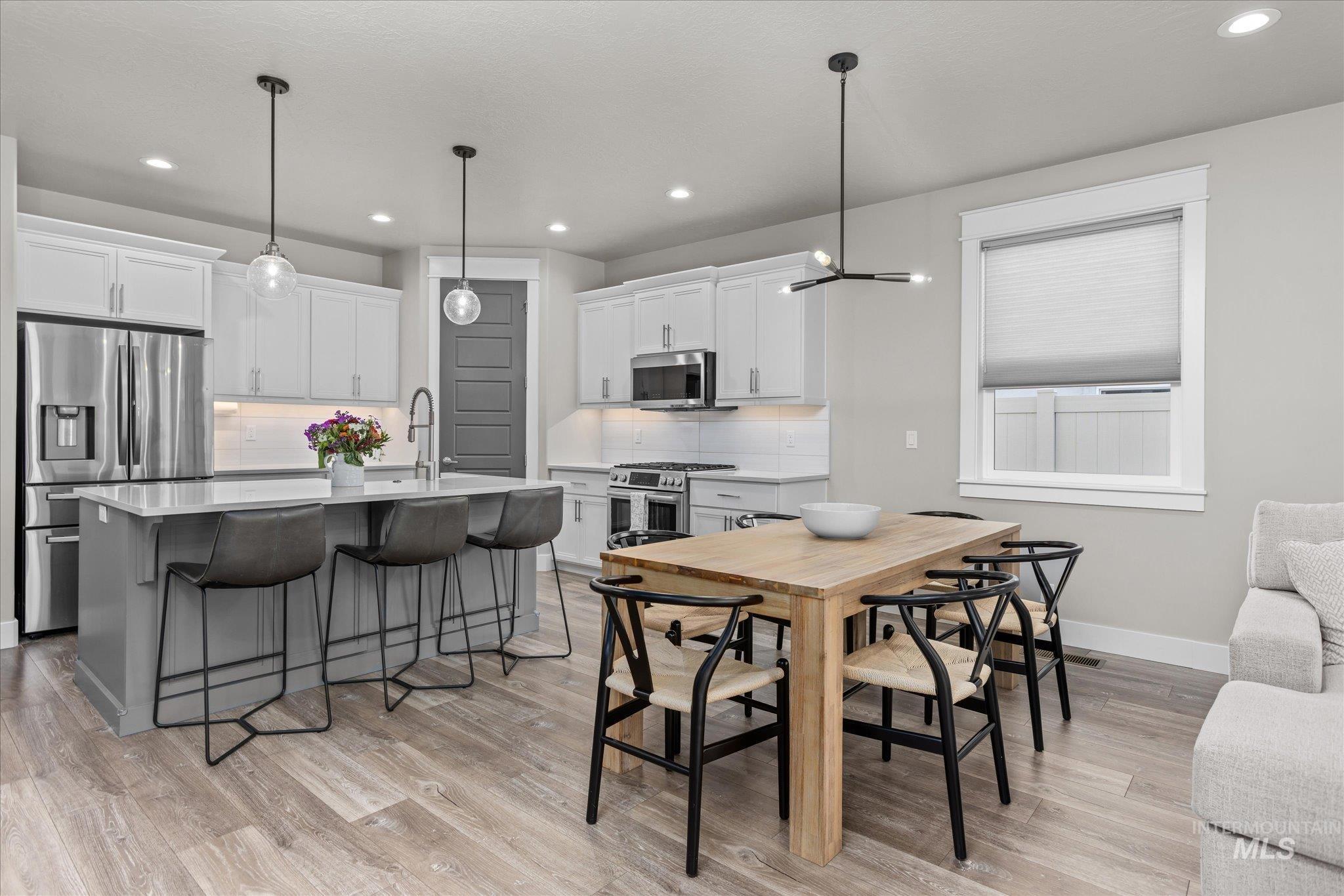 Dining room featuring recessed lighting and light wood-style floors