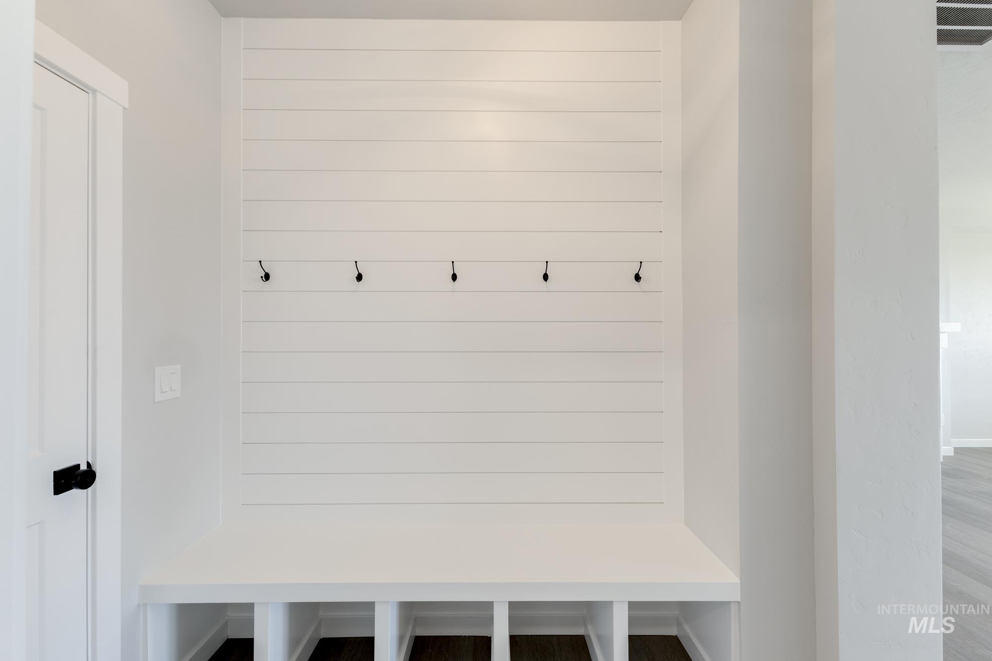 Mudroom featuring wood finished floors