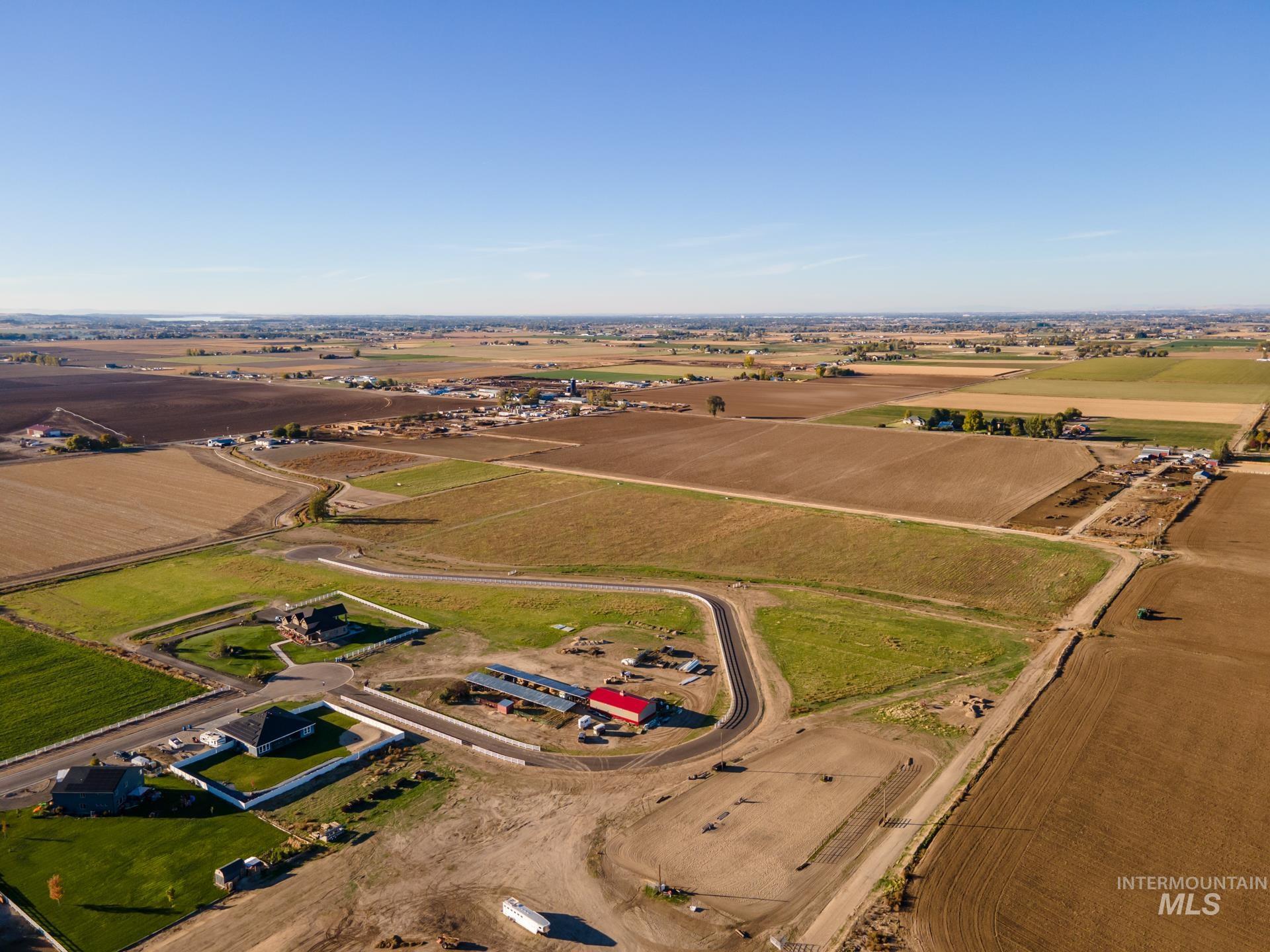 Aerial view of property and surrounding area featuring rural landscape