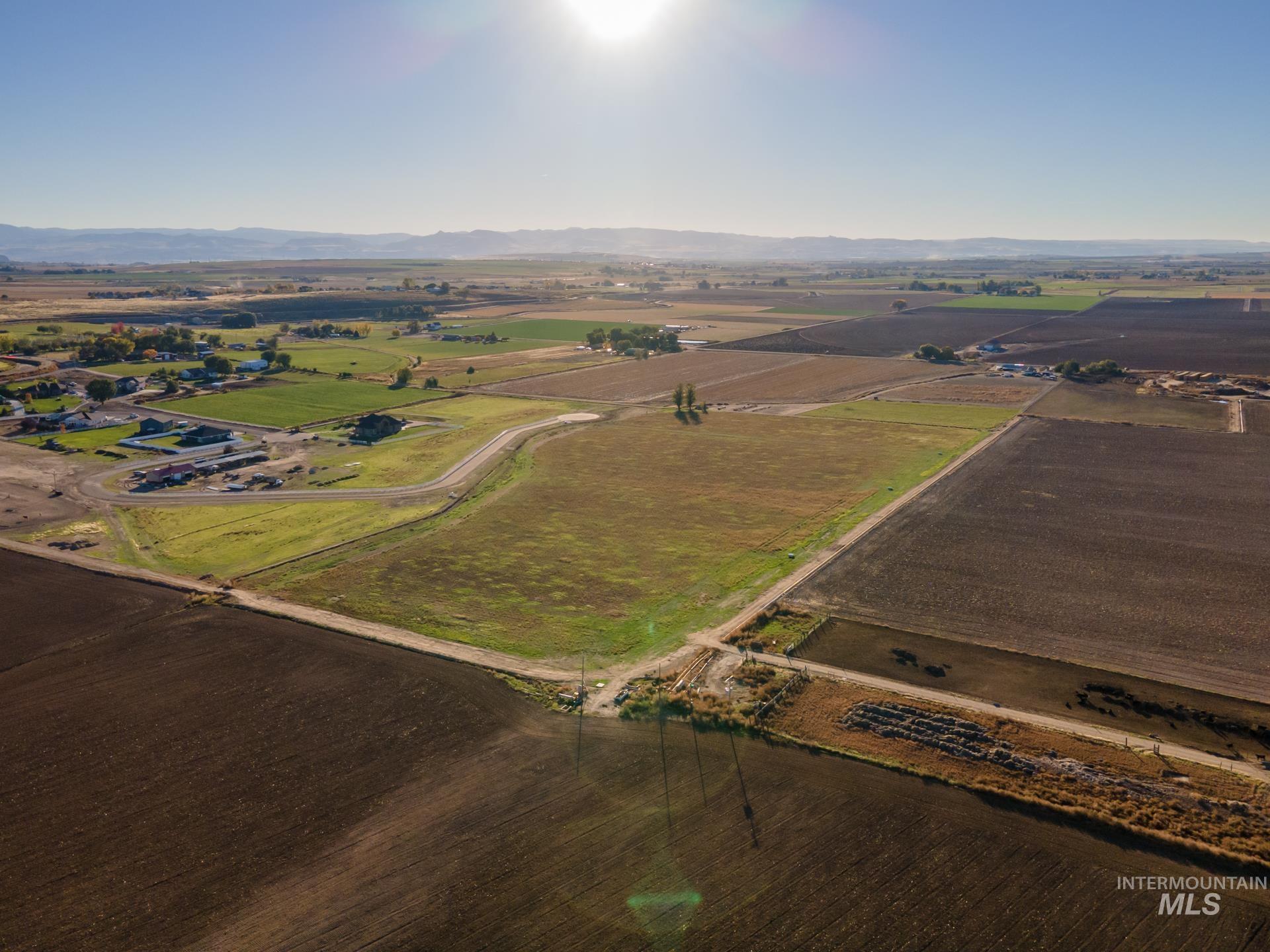 Aerial overview of property's location with rural landscape and extensive farmland