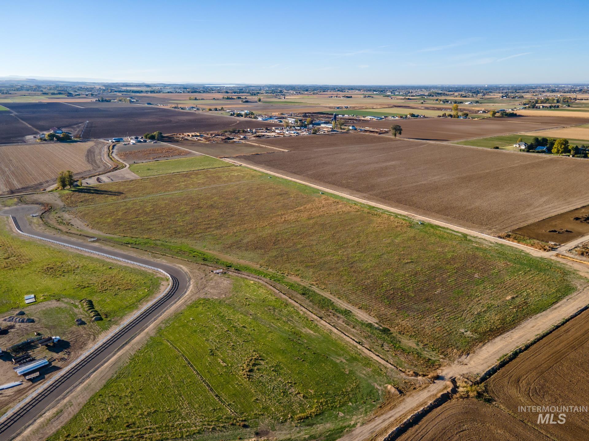 Aerial view of property's location with rural landscape and abundant farmland