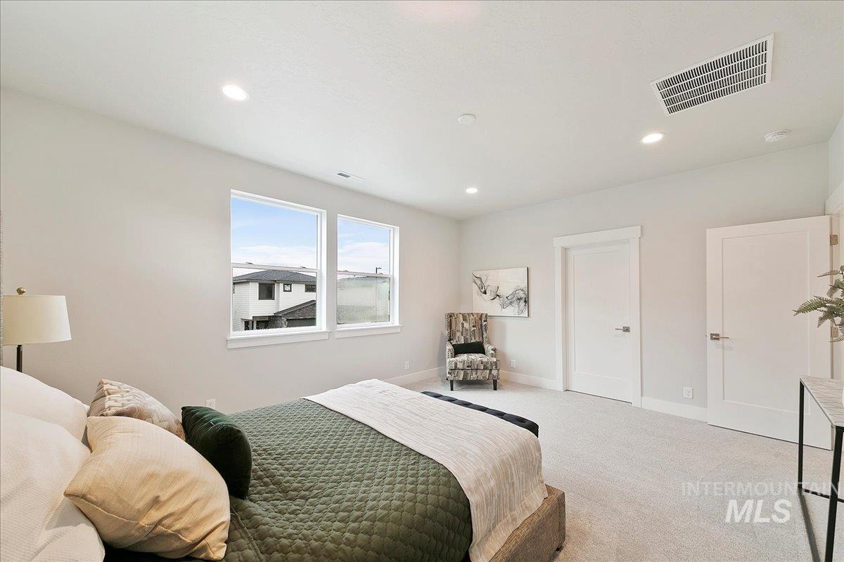Bedroom with carpet flooring and recessed lighting