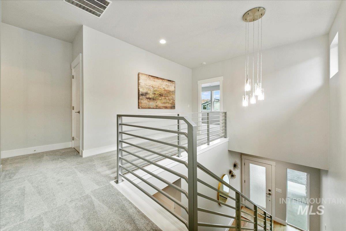 Stairs featuring carpet and recessed lighting