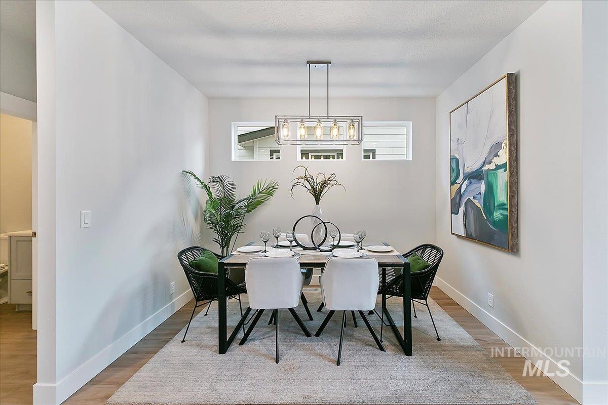 Dining area featuring baseboards and light wood-style floors