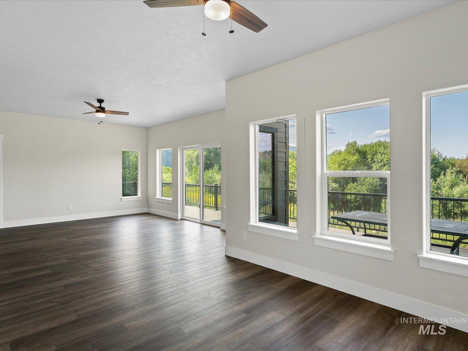 Family room that can be game room, office, home gym, craft room or more! Plenty of natural light and opens to 600 sf deck! 2 bedrooms, full bath, and kitchenette on this level could allow for rental space or multi-generational living!