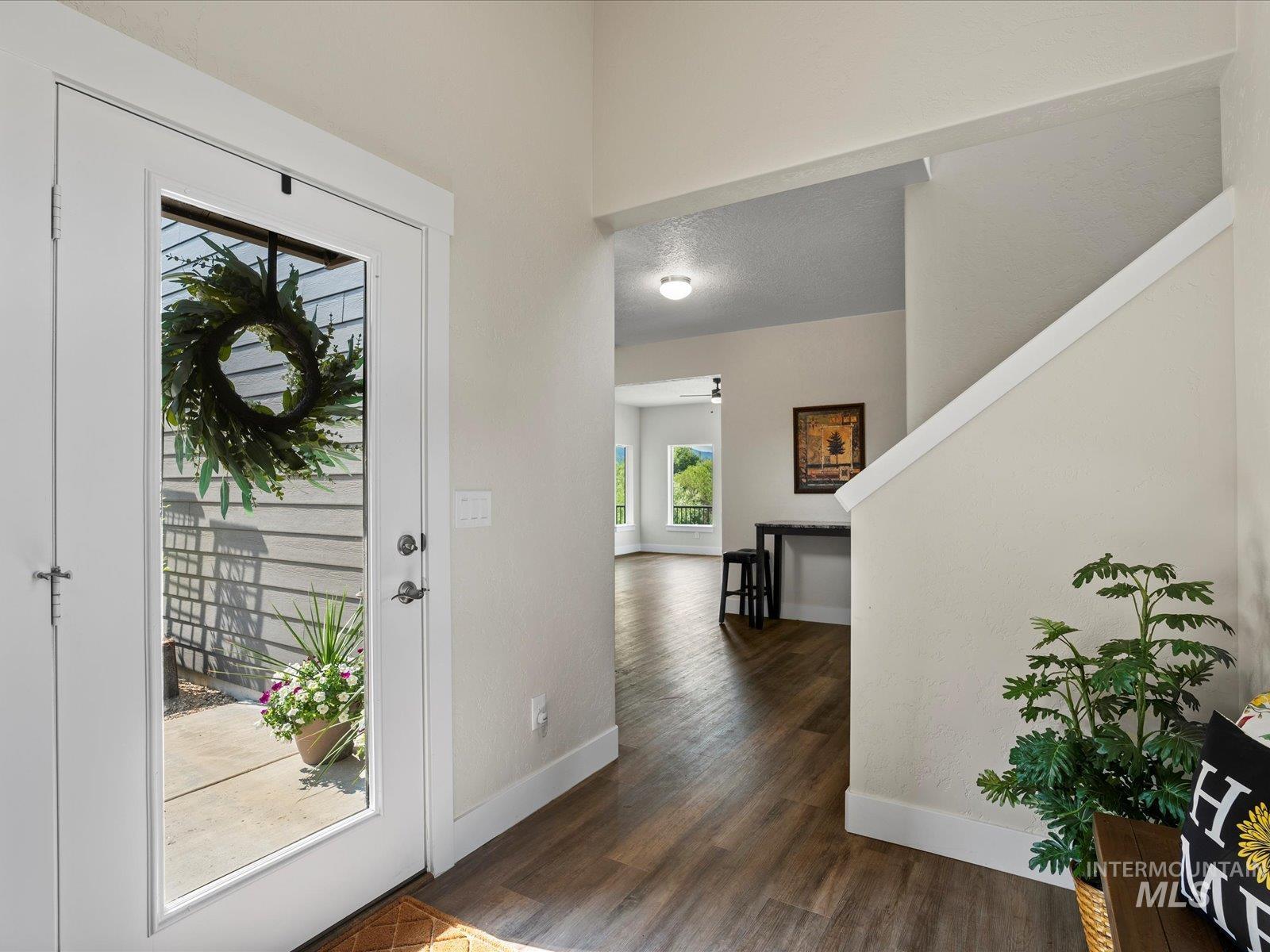 Foyer entrance featuring dark wood finished floors