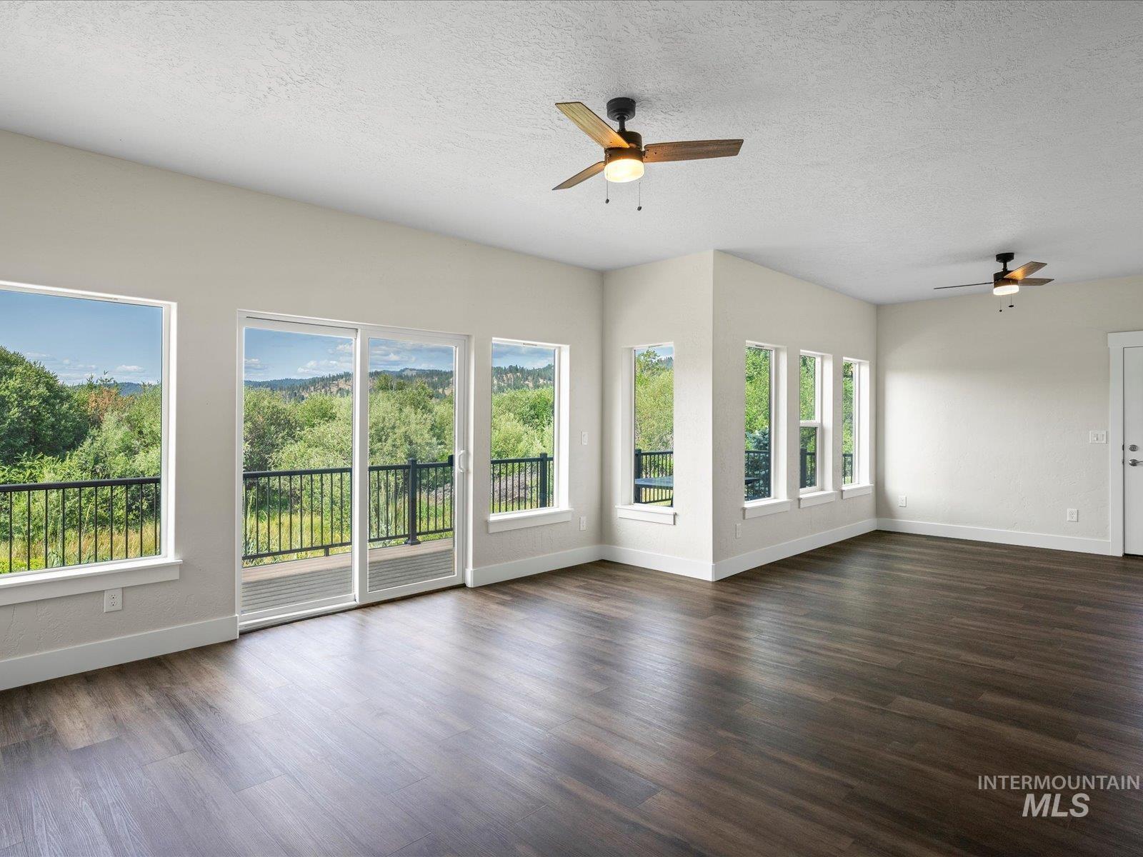 Family room offers space for game room, home gym or more, and opens to 600 sf deck