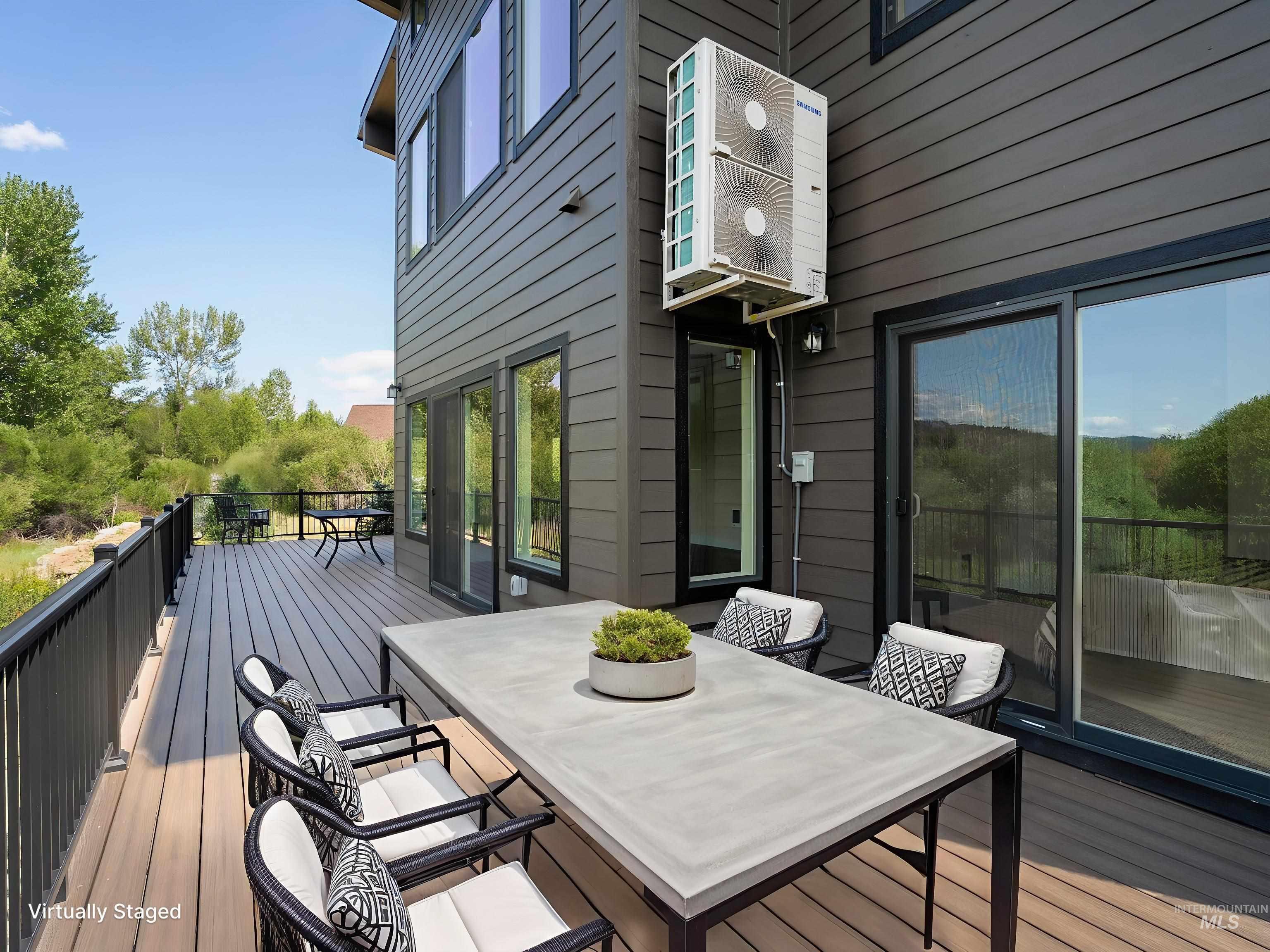 Wooden deck featuring outdoor dining space