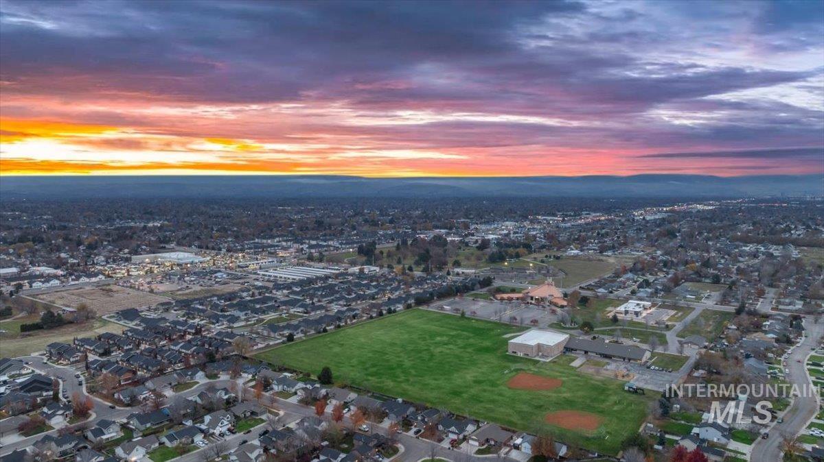 Aerial view of property's location with nearby suburban area