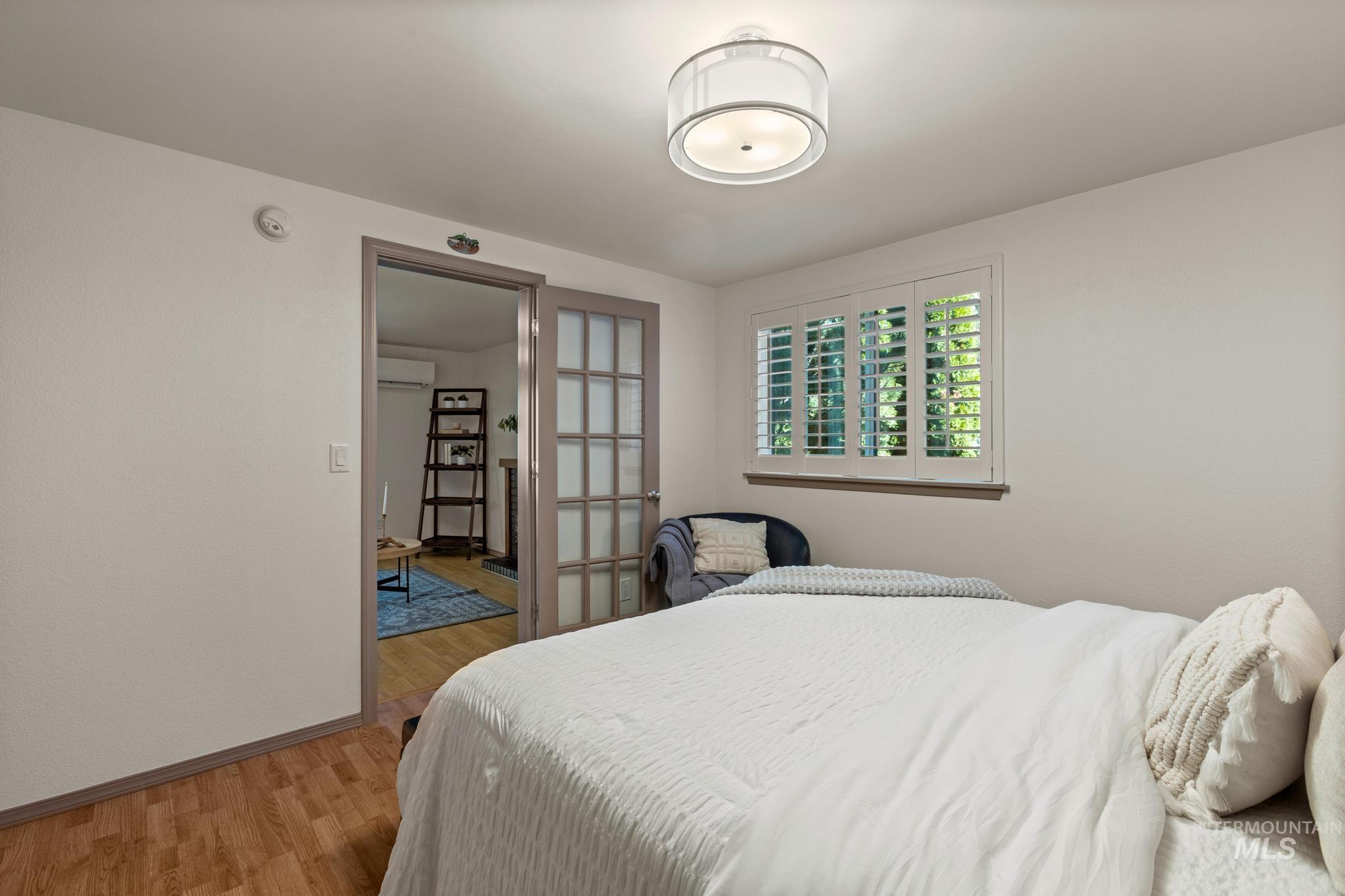Bedroom featuring light wood-type flooring and a mini split for heating / cooling