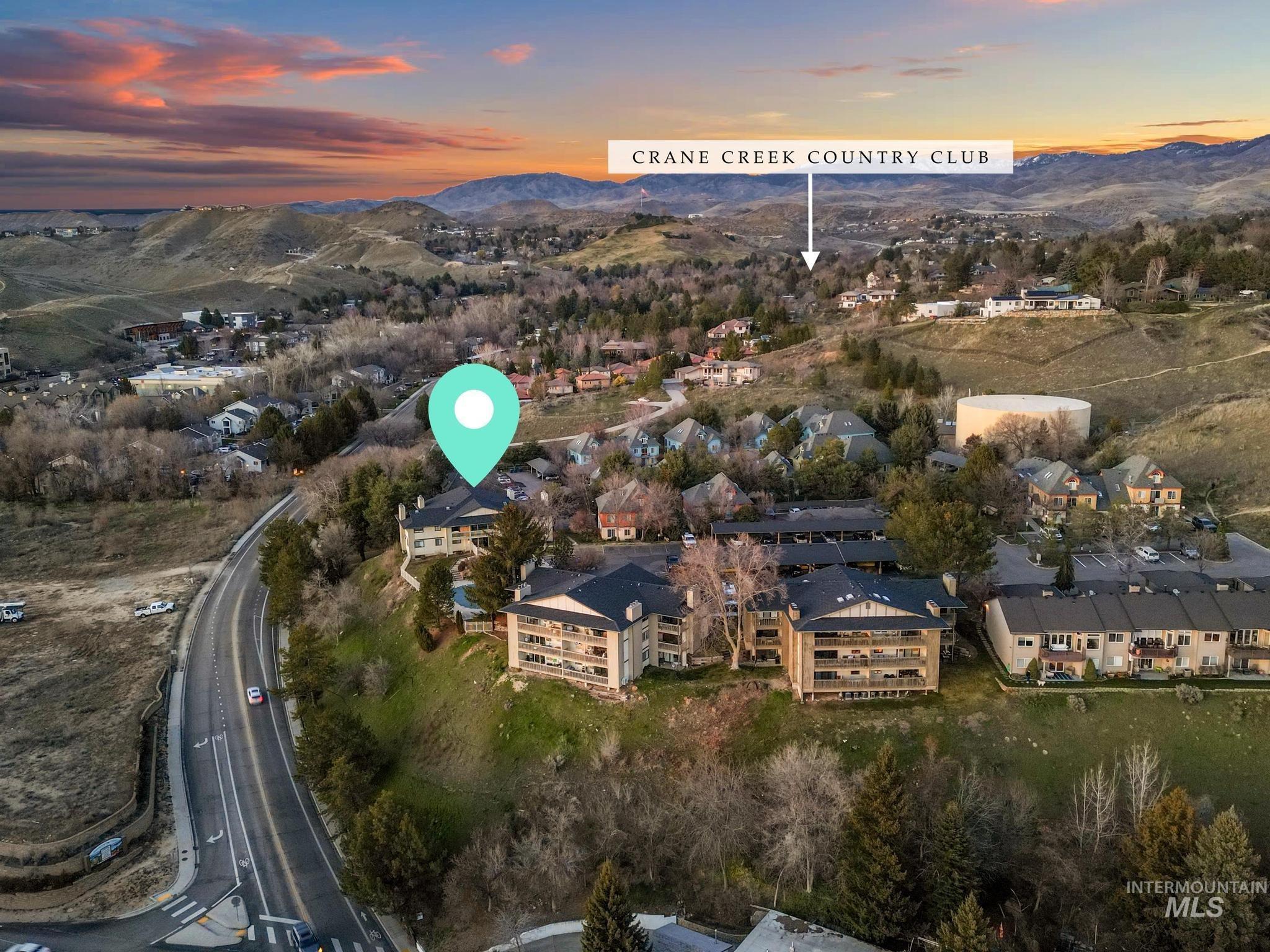 Aerial view at dusk of a mountain view and a residential view
