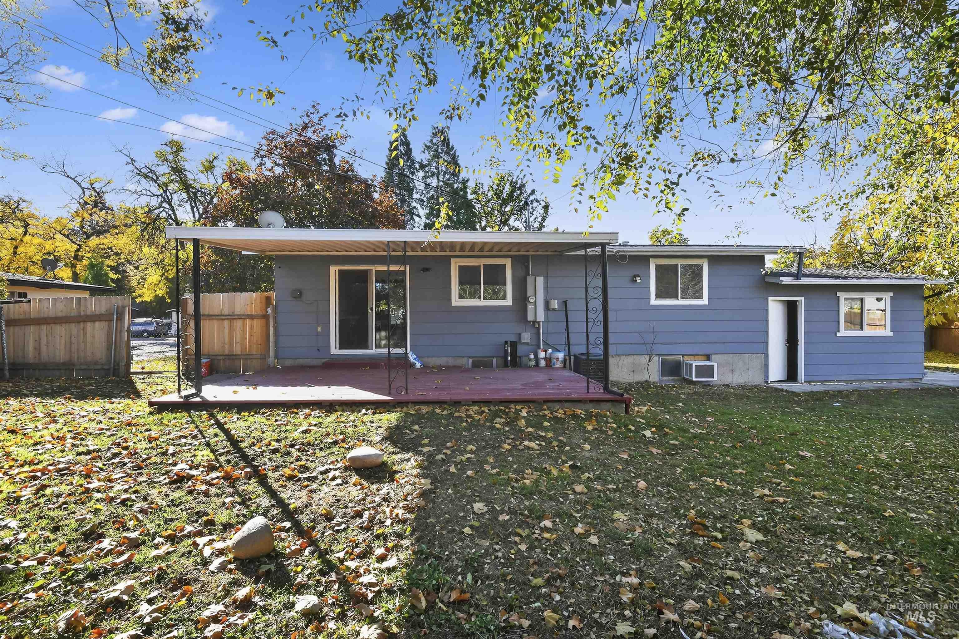 Back of property featuring a deck