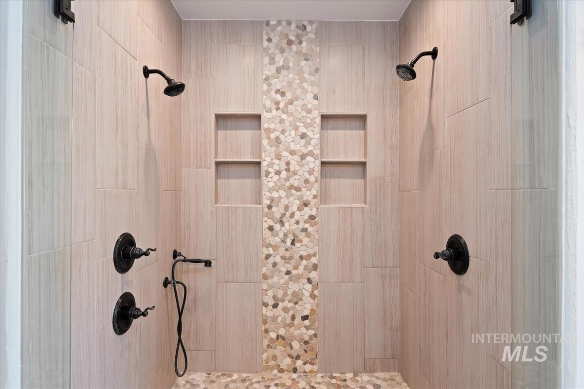 Full bathroom featuring a shower stall