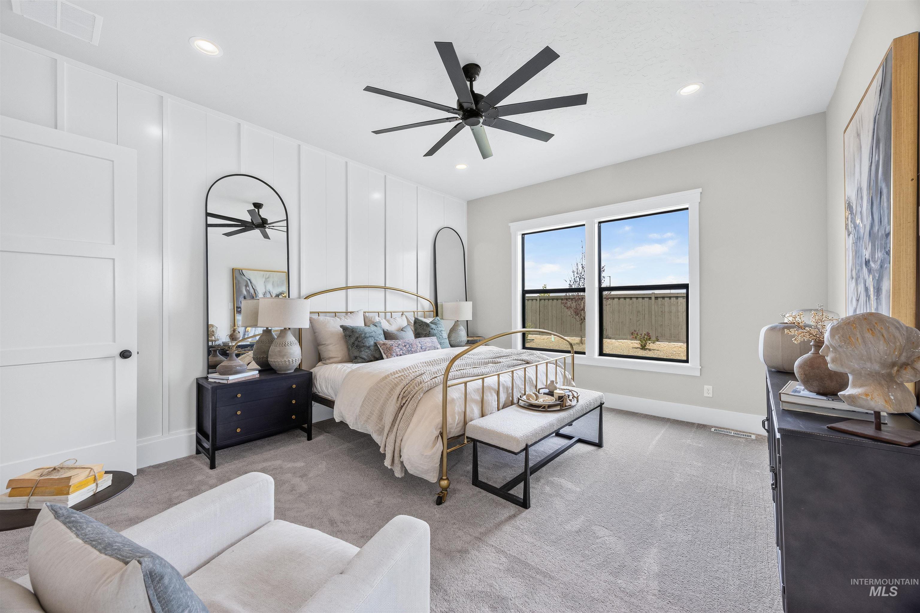 Room featuring a sophisticated board and batten accent wall, recessed lighting, and a modern ceiling fan