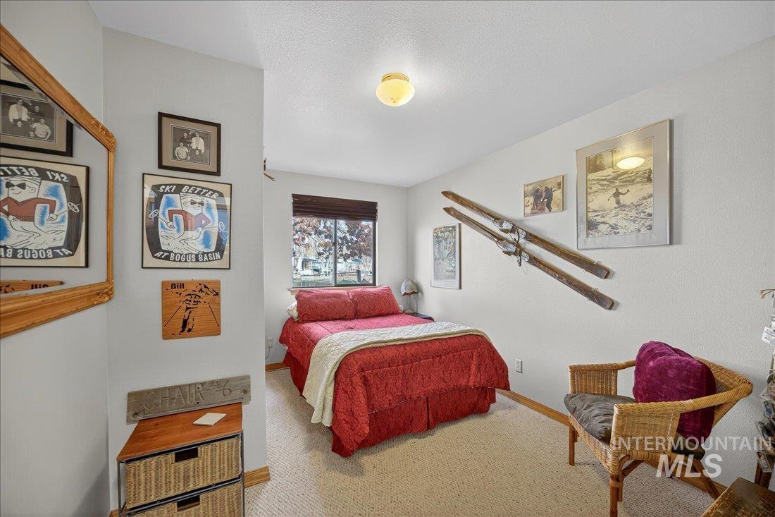 Carpeted bedroom with baseboards