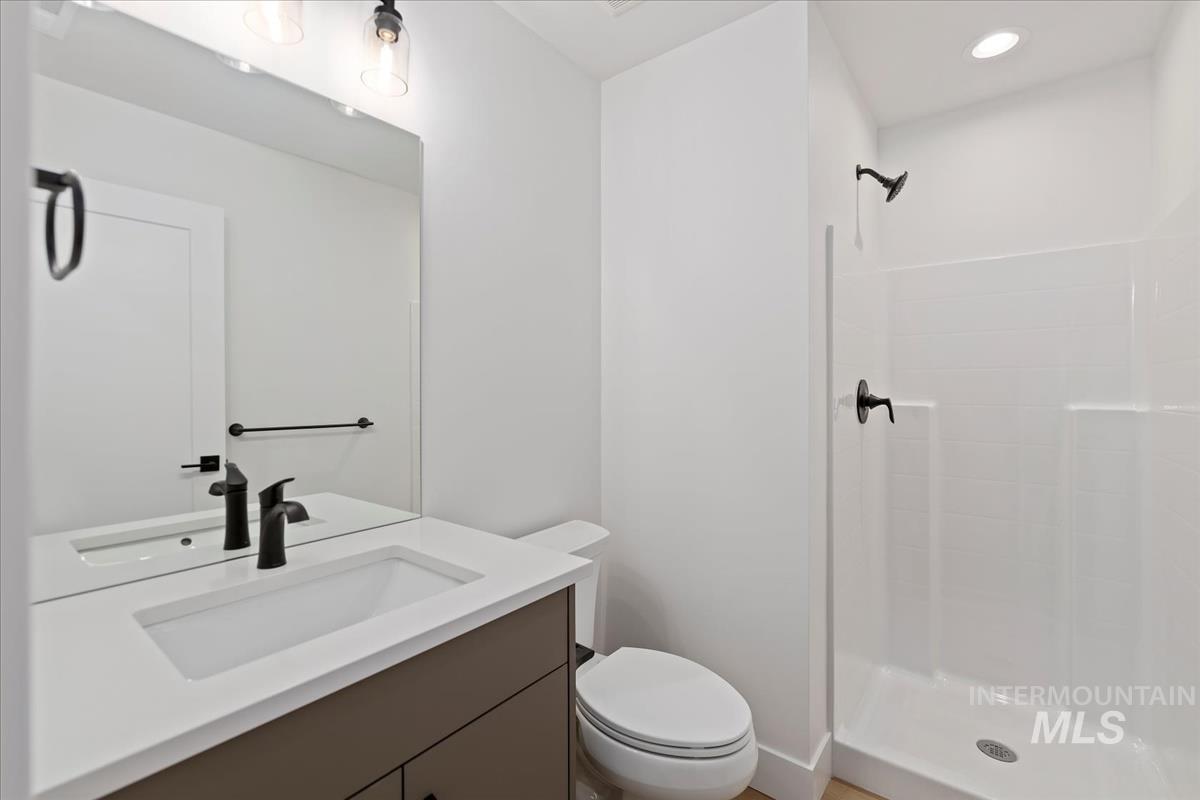 Bathroom with vanity and a shower