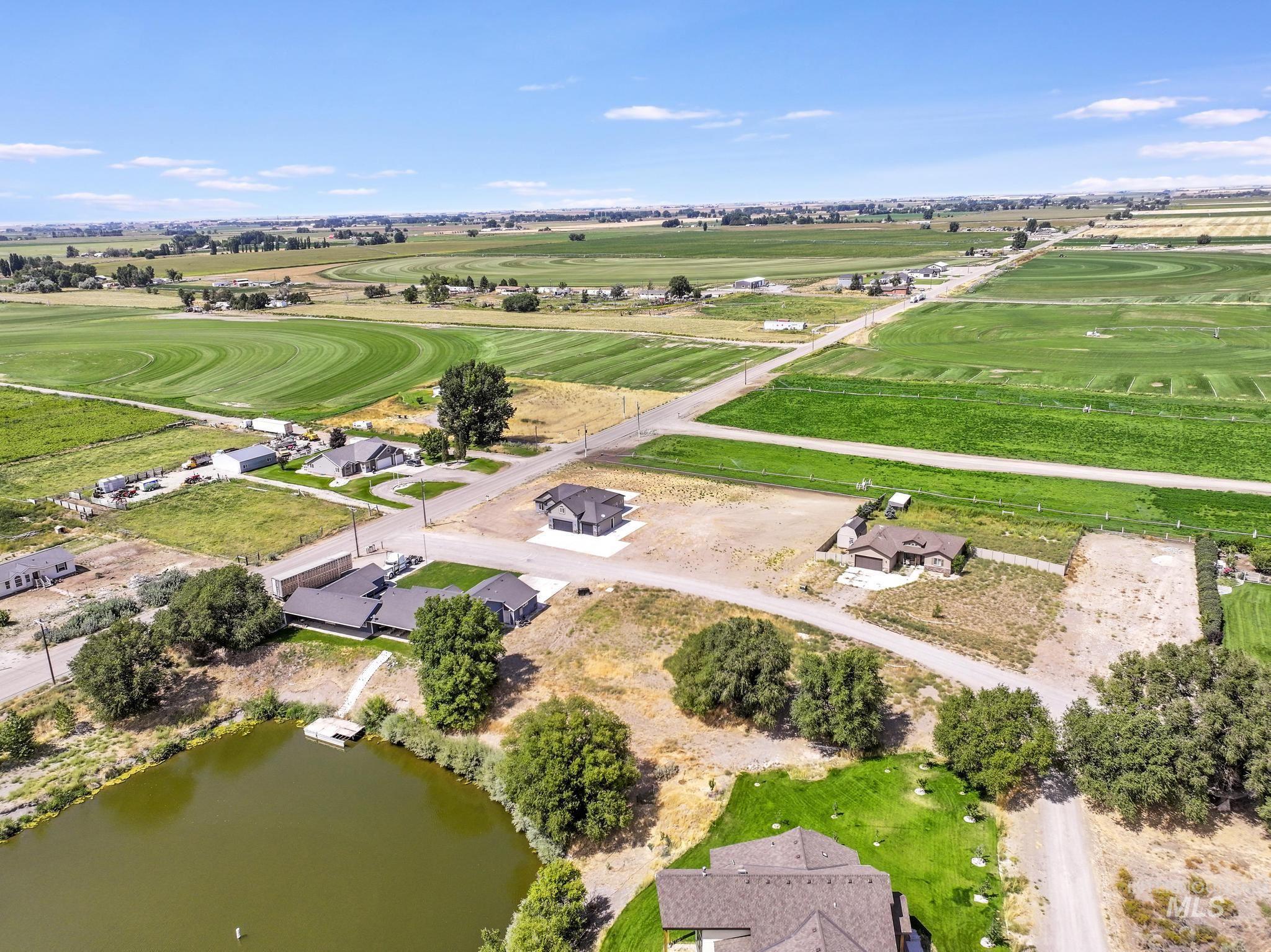 Aerial view of property's location featuring a nearby body of water and rural landscape
