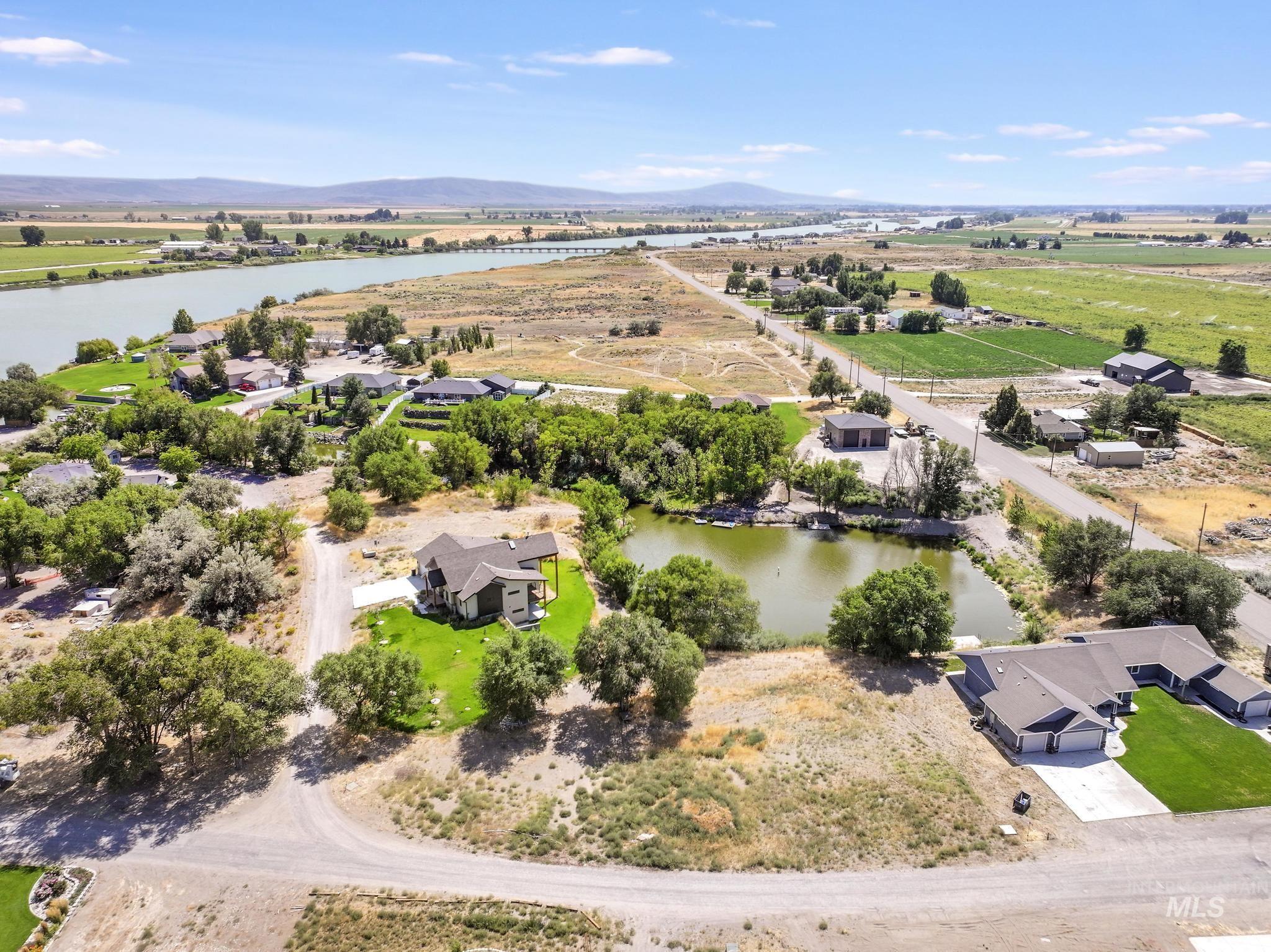 Aerial view of sparsely populated area with a water and mountain view
