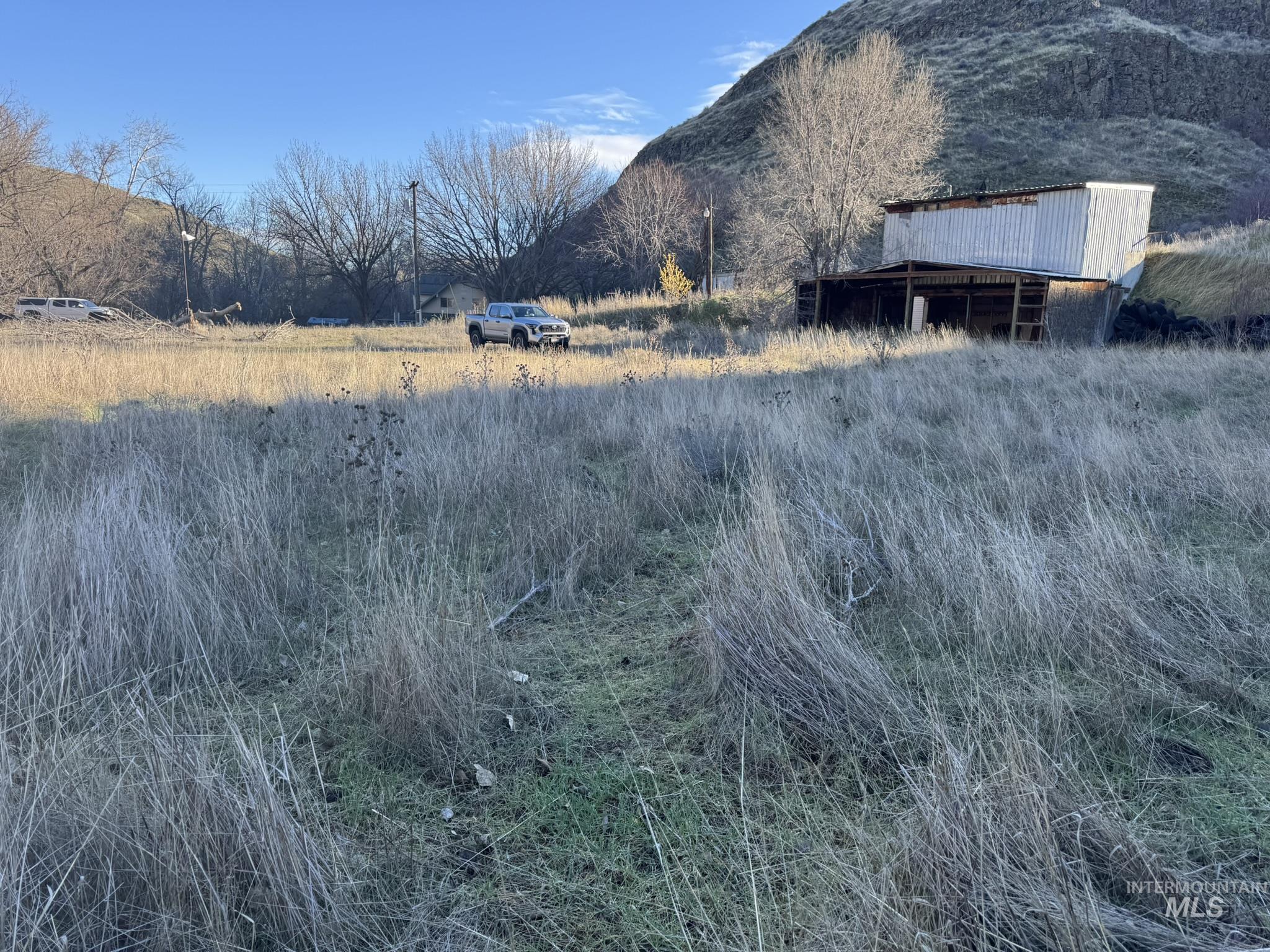 View of mountain backdrop with rural landscape